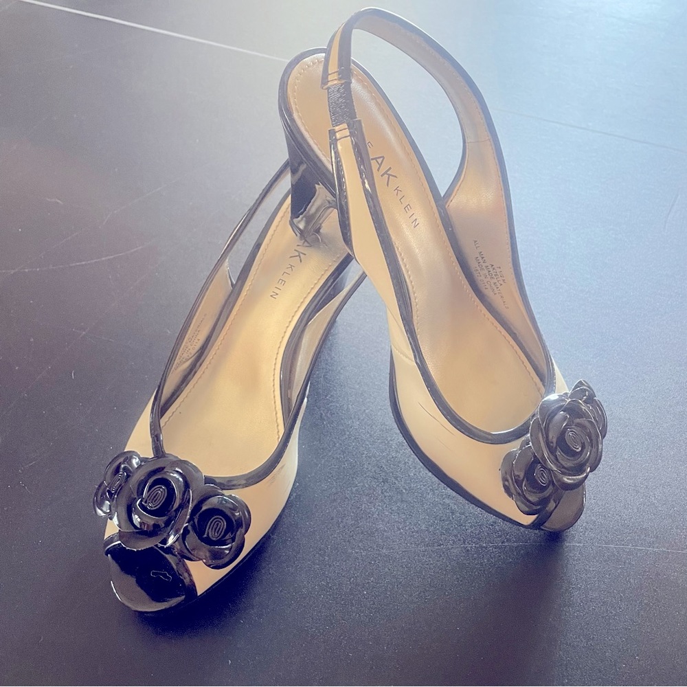 White and black patent leather peekaboo toe heels